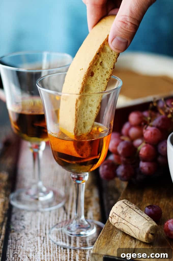Dipping biscotti in Italian Dessert wine Vin Santo
