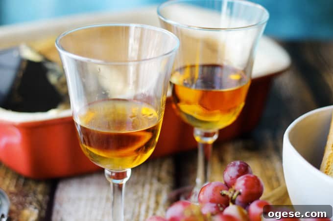 Italian Dessert wine Romandolo in glasses with desserts on a side