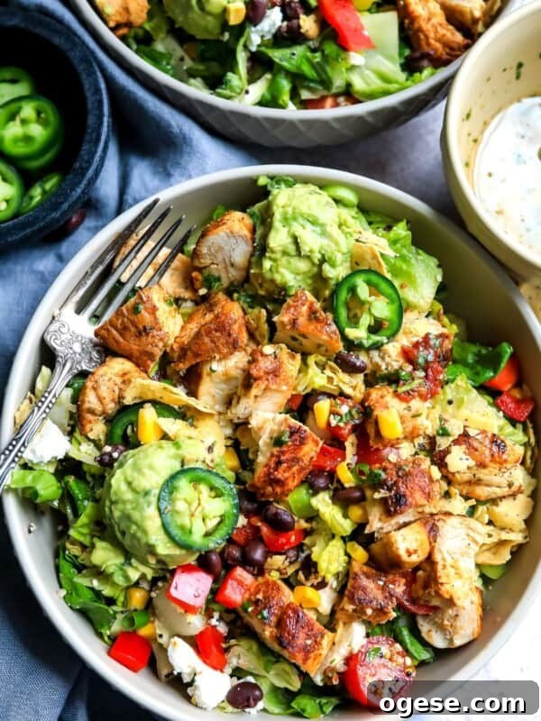 Big bowl with salad and lots of toppings.