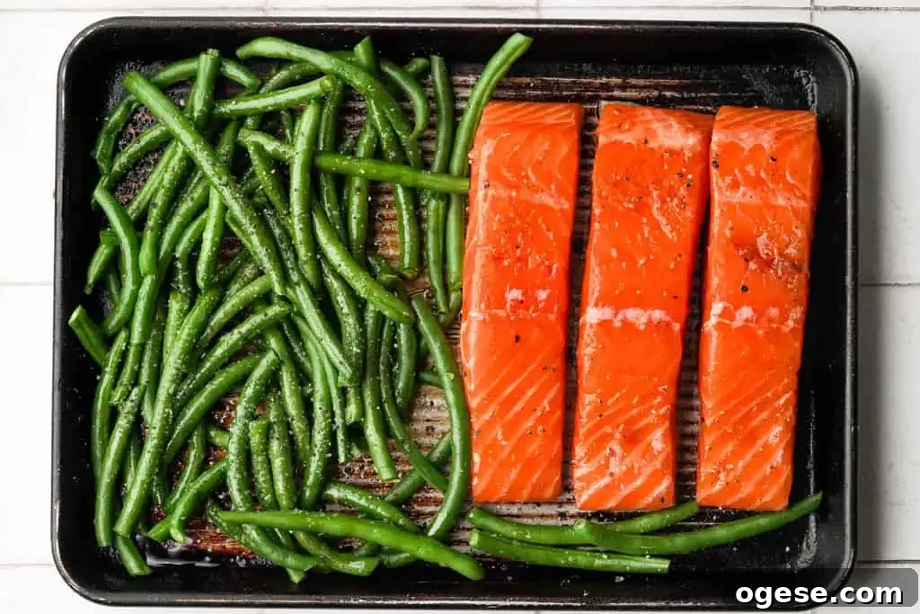 Roasting Salmon and Beans marinated salmon and asparagus on a baking sheet