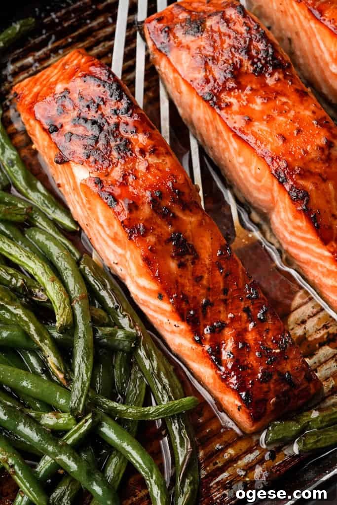 Oven Baked Salmon Recipe close up view of sheet pan salmon and asparagus