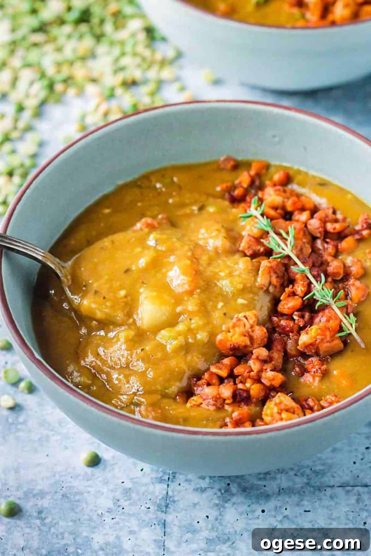 Instant Pot Vegan Split Pea Soup with Smoky Flavor 7 Spoonful of soup being lifted from the bowl.