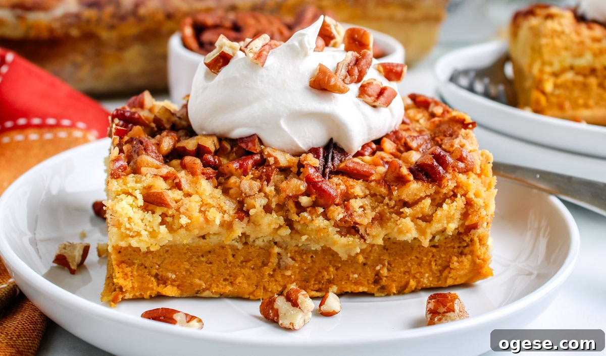 A piece of easy pumpkin dump cake on a white plate.