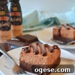 Baileys Chocolate Mousse Brownies Recipe 7 Bailey's Mousse Brownies on white plates with mini bottles of Bailey's in background
