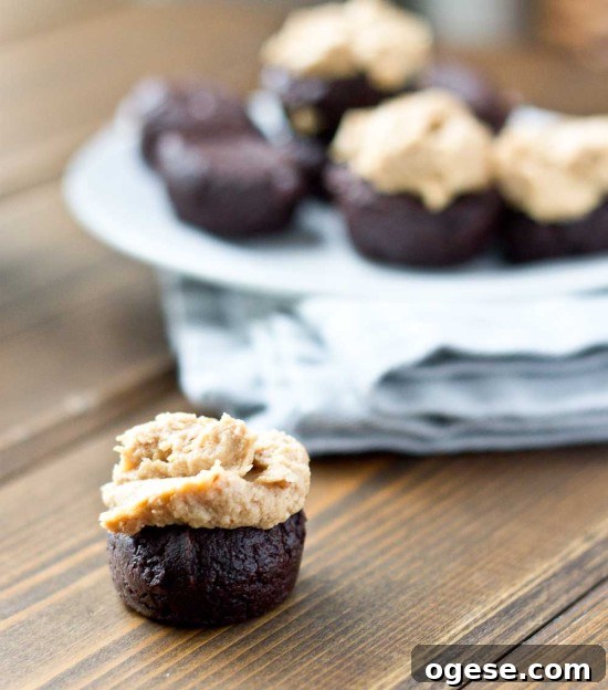 Flourless Fudge Brownie Bites with Greek Yogurt Frosting 3 Mini flourless brownie bites cooling on a wire rack