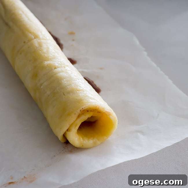 Spreading cinnamon filling onto dough