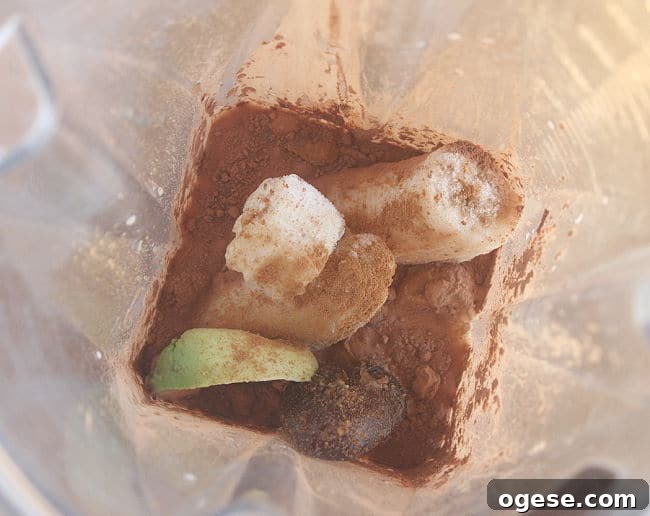 Creamy Chocolate Peanut Butter Banana Smoothie 4 Banana, avocado, milk, and cocoa powder in a blender.