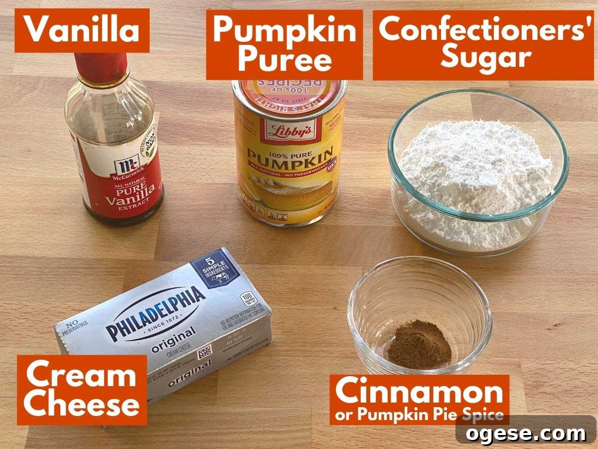 Creamy Pumpkin and Cream Cheese Dip for Fall Parties 3 Labeled ingredients to make pumpkin dip: pumpkin puree, vanilla, confectioners' sugar, cream cheese, and cinnamon.