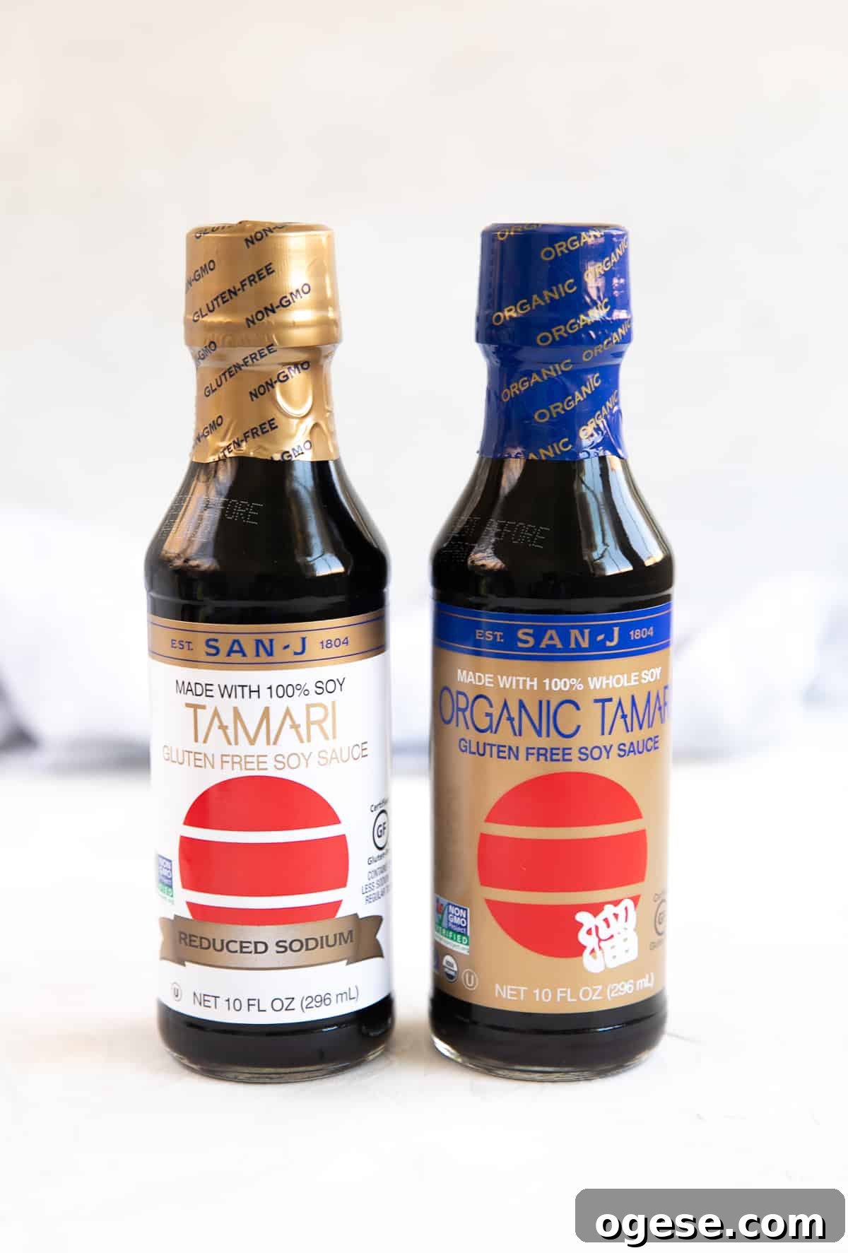 Two bottles of unopened tamari - one that is organic and one that is low-sodium.