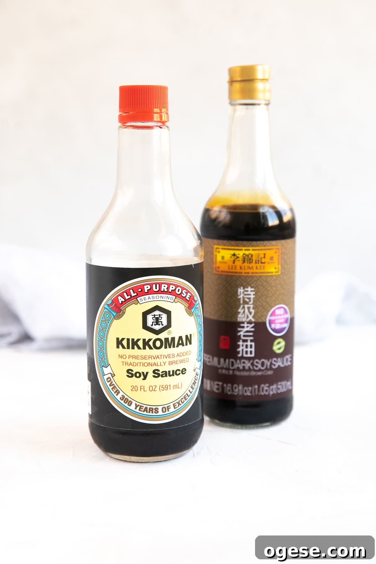 One bottle of Kikkoman soy sauce and one bottle of dark soy sauce.