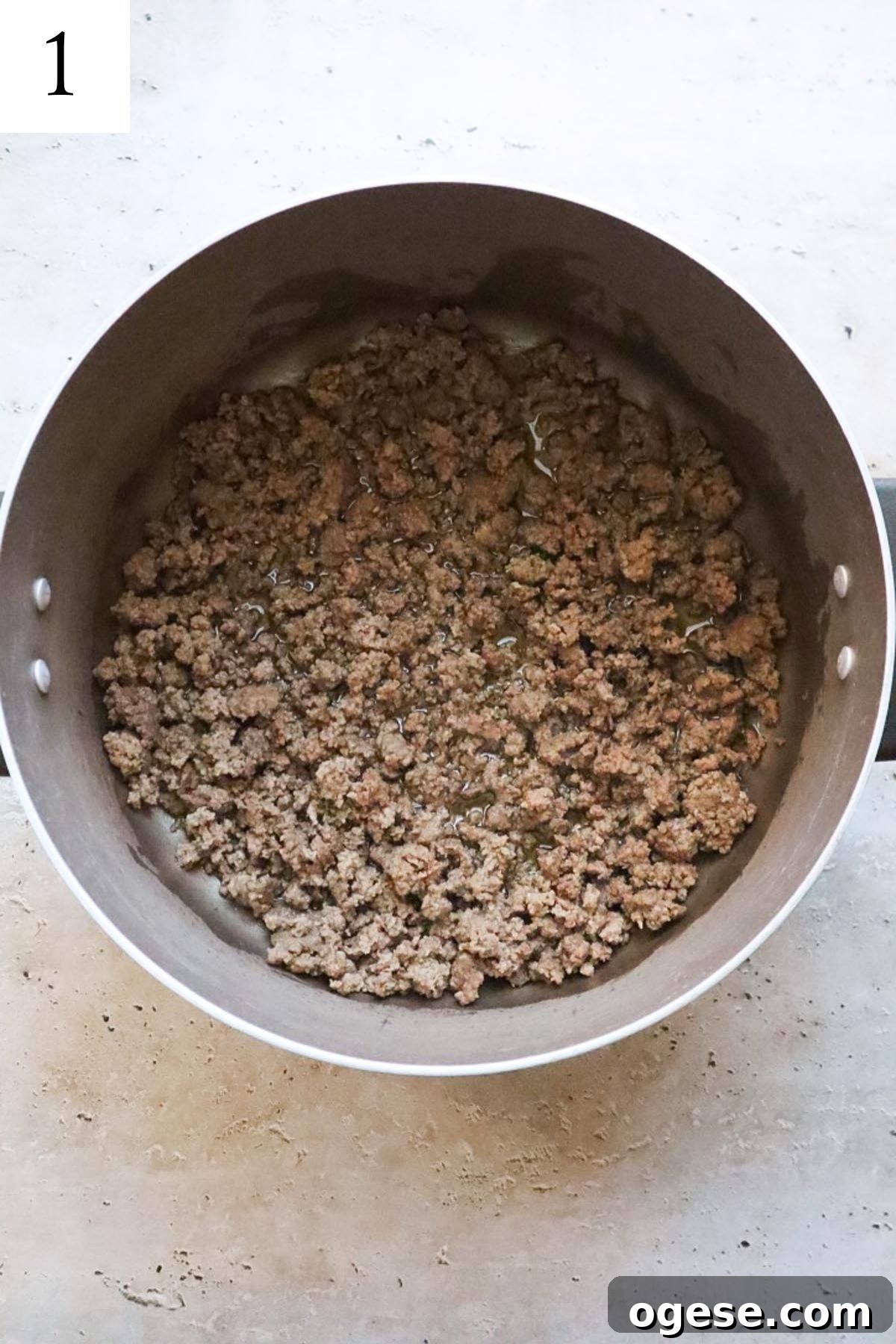 pot with crumbled cooked ground beef.