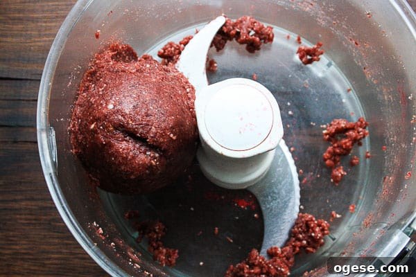 Raw Cranberry and Nut Energy Bar dough in a food processor