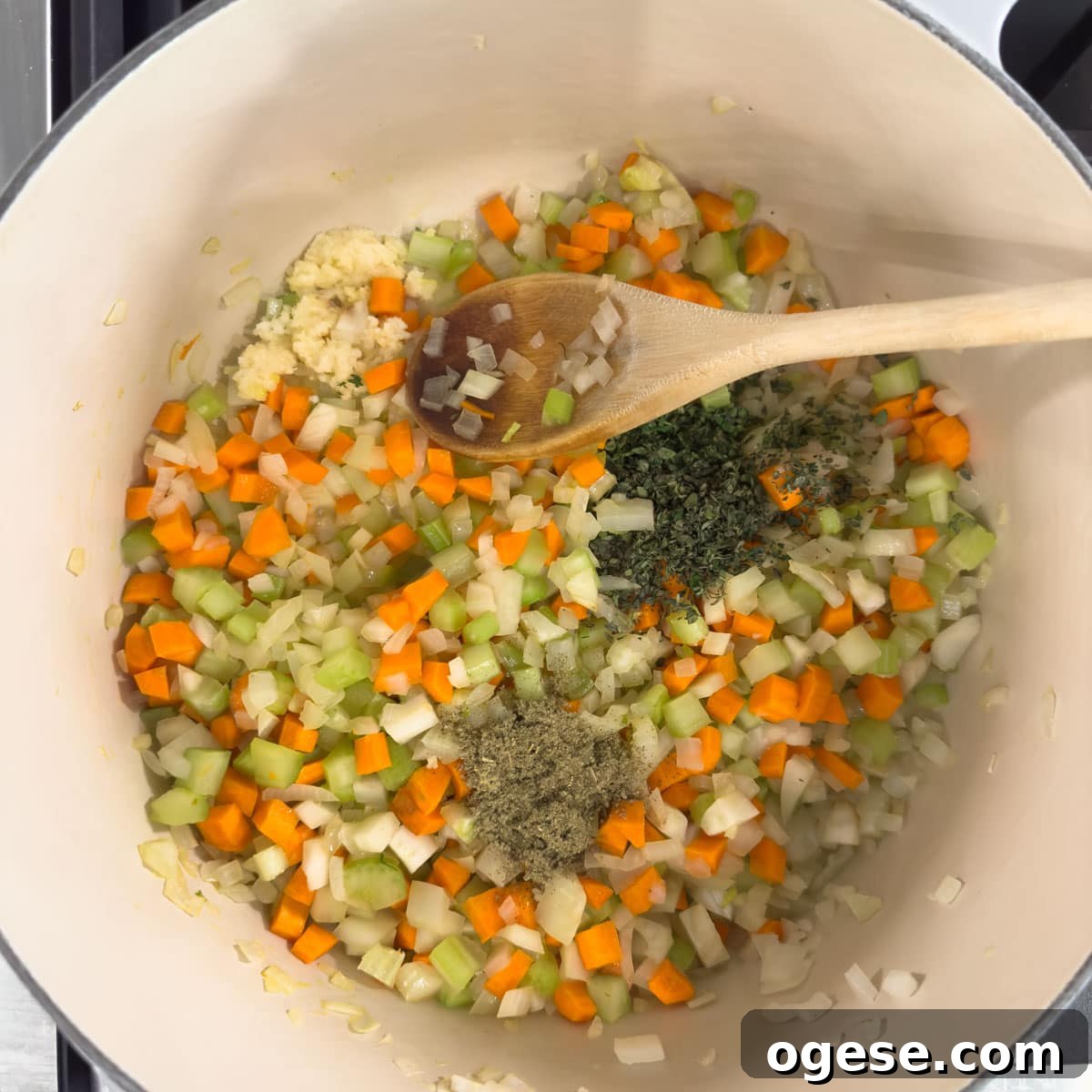 Tuscan White Bean Soup Recipe with Garlic and Kale 4 Sautéing vegetables as the base for a soup in a Dutch oven.