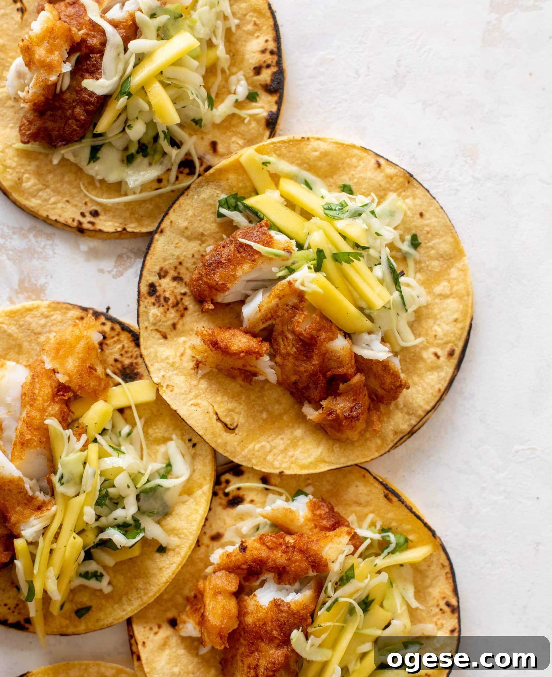crispy fish tacos with mango slaw