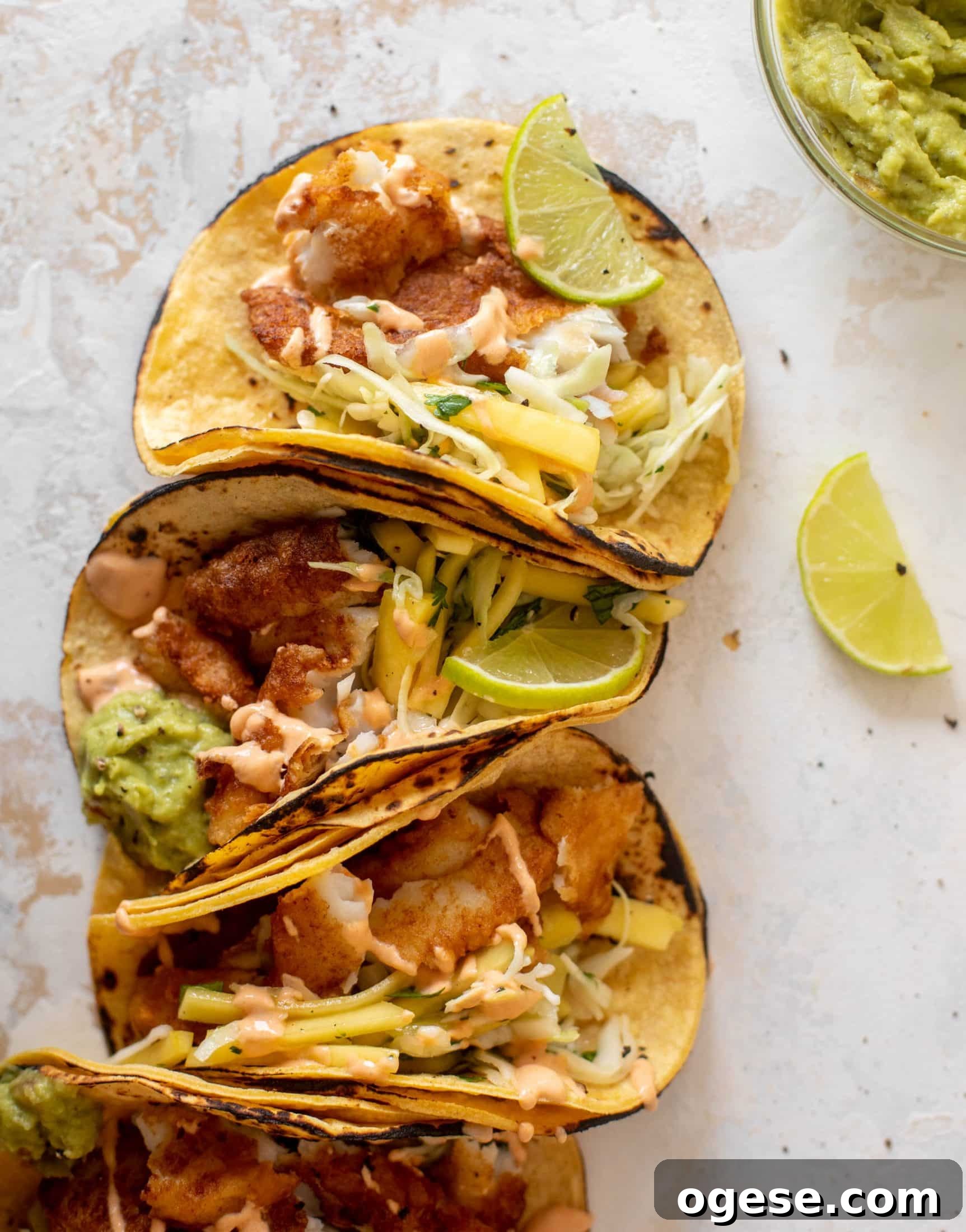 crispy fish tacos with mango slaw