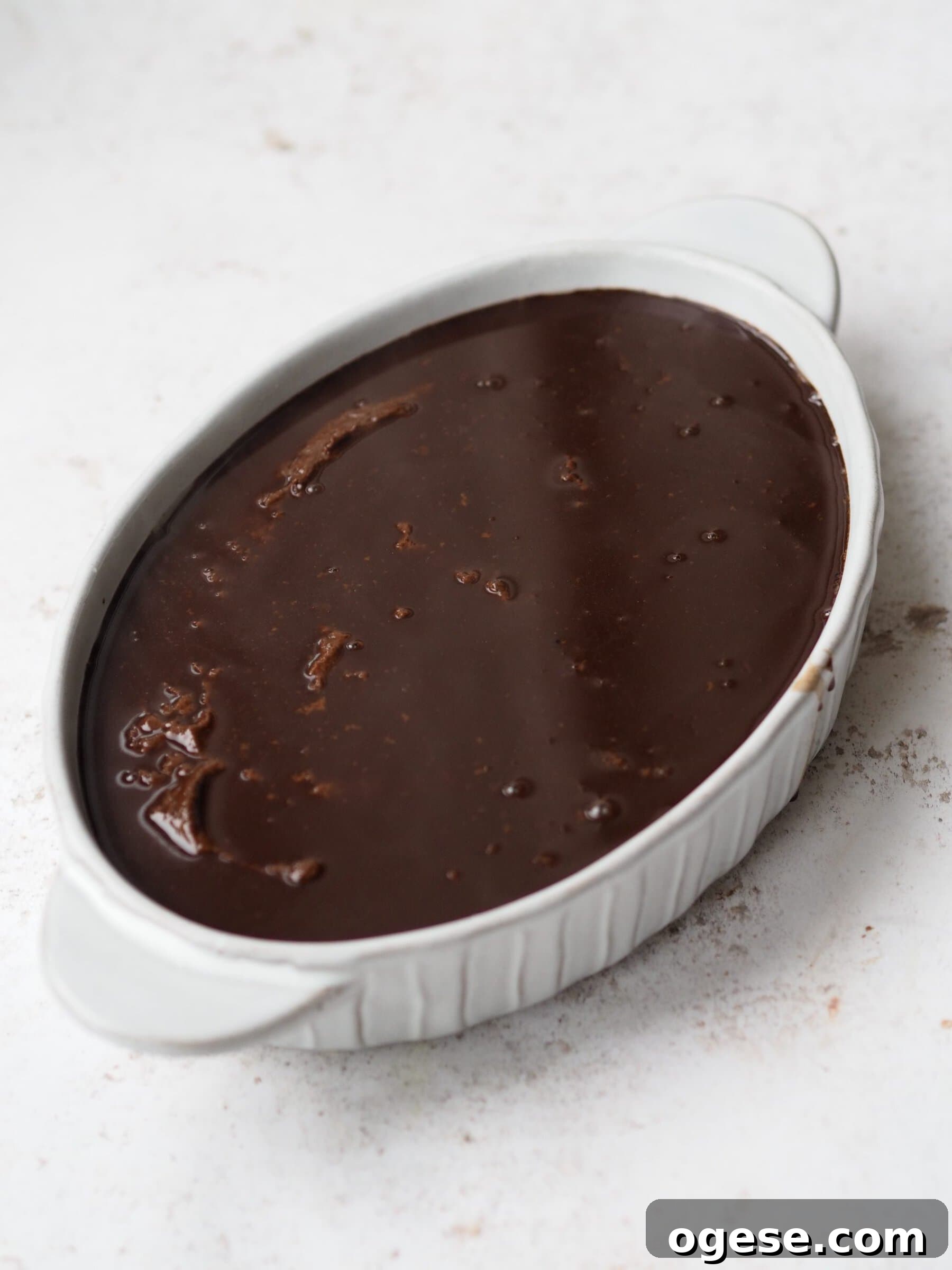 Self Saucing Chocolate Pudding in a white baking dish before baking.